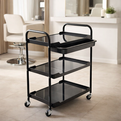 Black serving cart with three shelves in a room setting