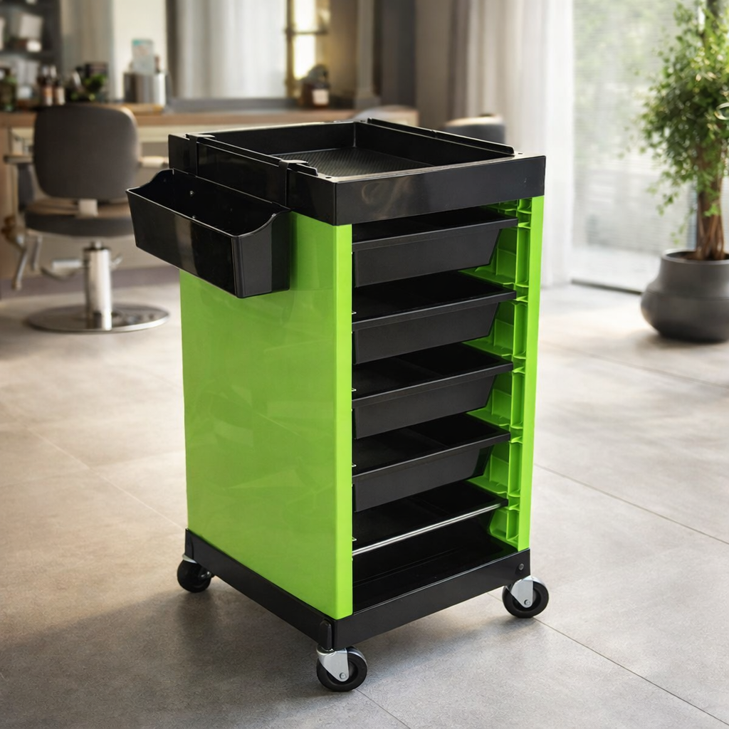 Green and black rolling cart with storage drawers in a room setting.