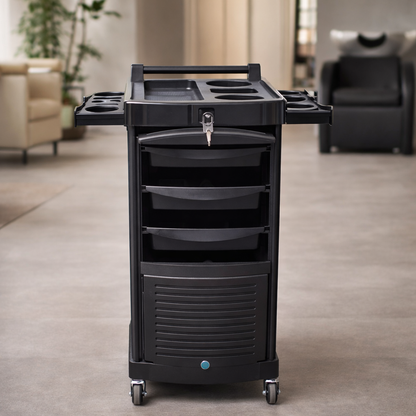 Black rolling cart with multiple drawers and compartments in a room setting.